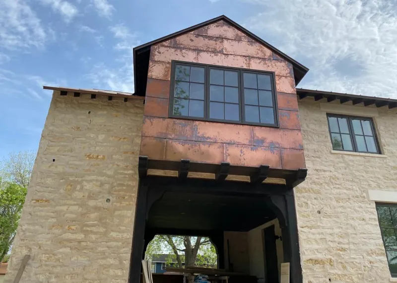 Copper metal panel facade on a stone building for Roof Repair in Casa de Oro-Mount Helix